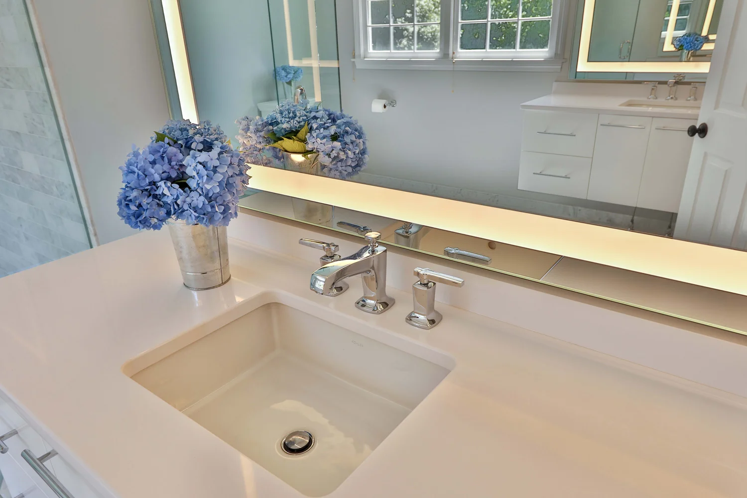 Countertops on the vanities were Silestone White Zeus.