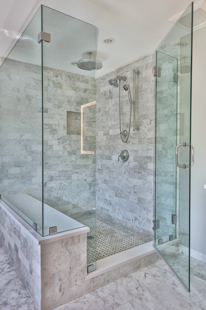 The shower door enclosure is a three-quarter inch glass frameless with chrome hardware.
