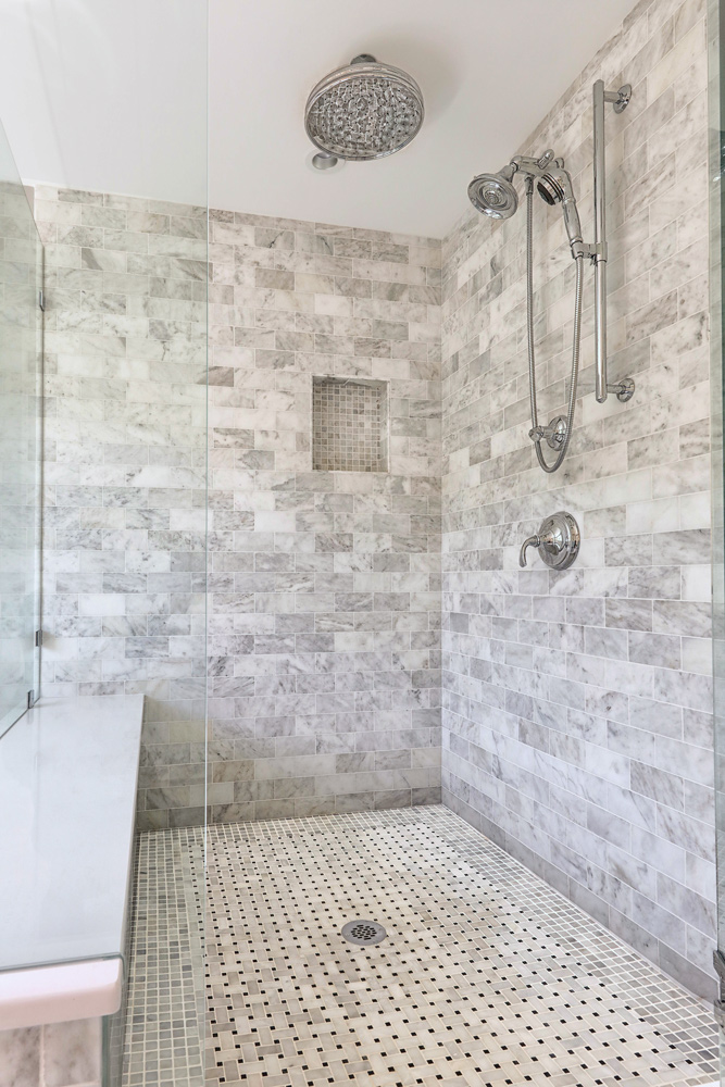 The 4 x 4' walk in shower also incorporated a bench seat in White Zeus Silestone.
