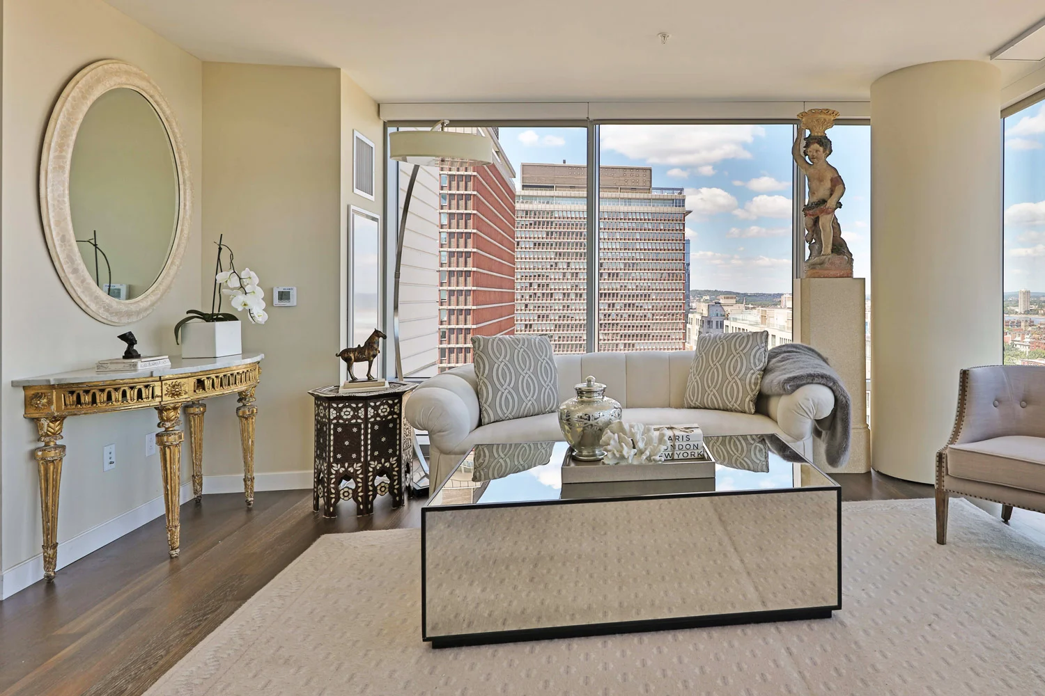 A 5-foot wide antique marriage coffee table was the focal point in the sofa area.