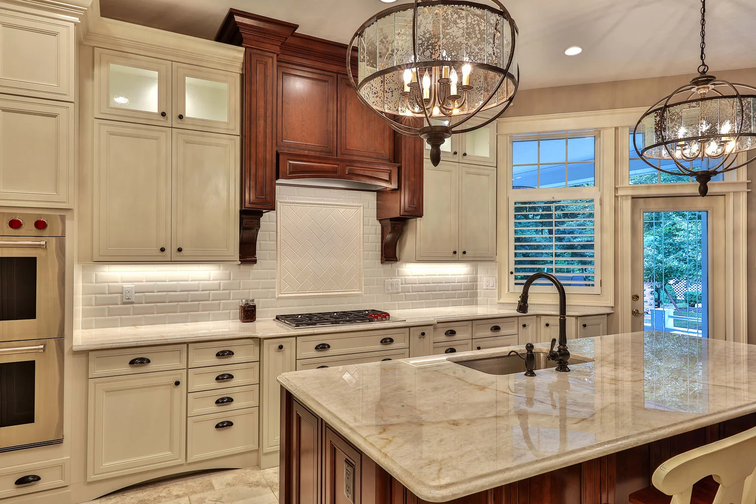 This kitchen has new golden beach granite countertops and tumbled stone backsplash.