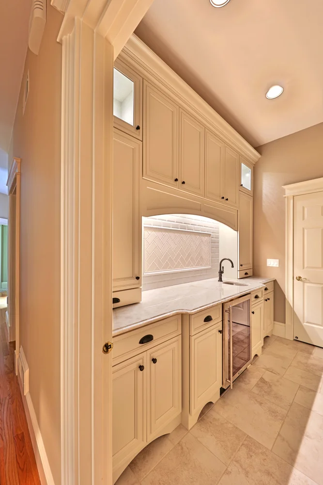 The Kohler faucet and cabinet hardware has an oil rubbed bronze finish.