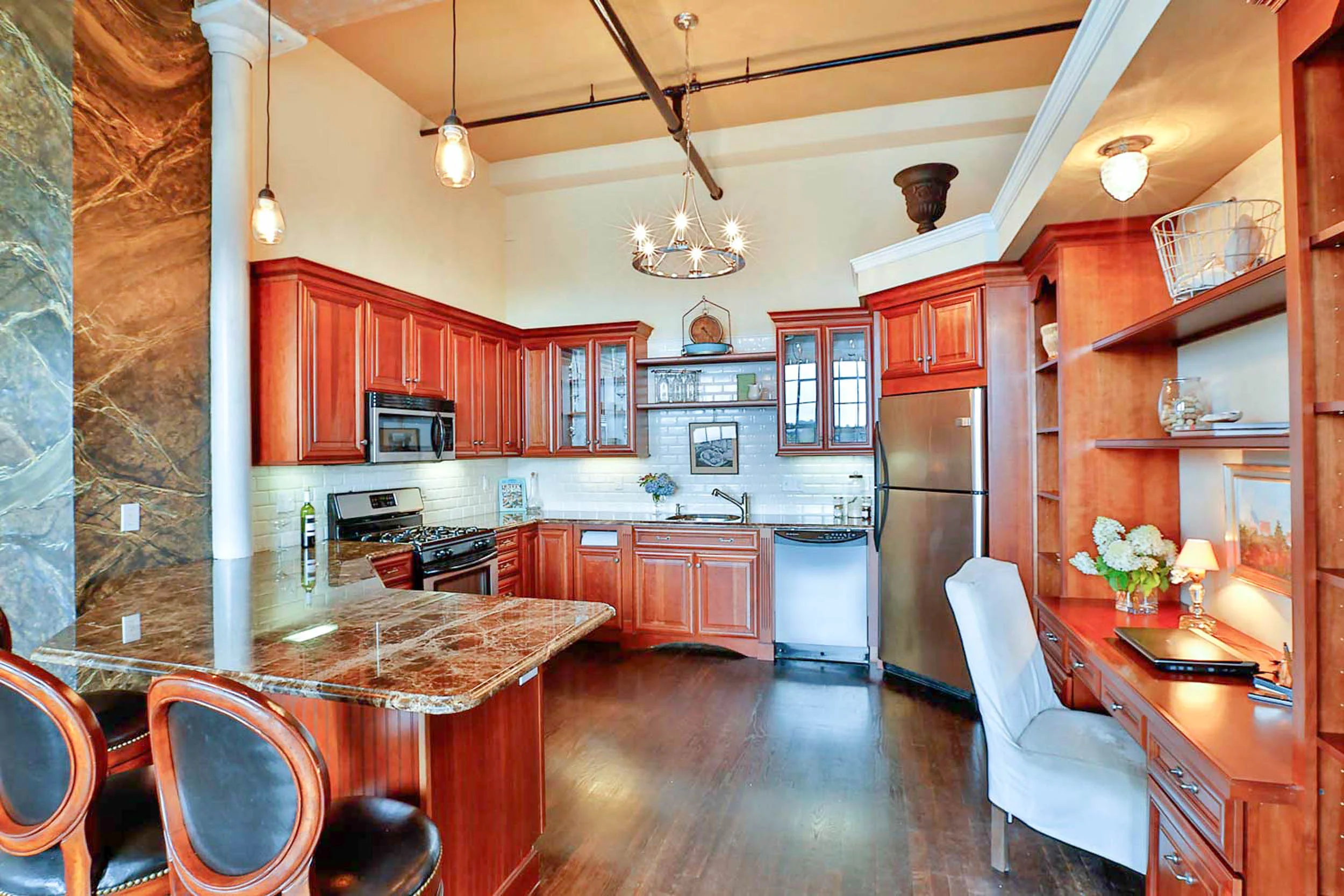 A contemporary open concept kitchen that feels at home in this former textile factory.