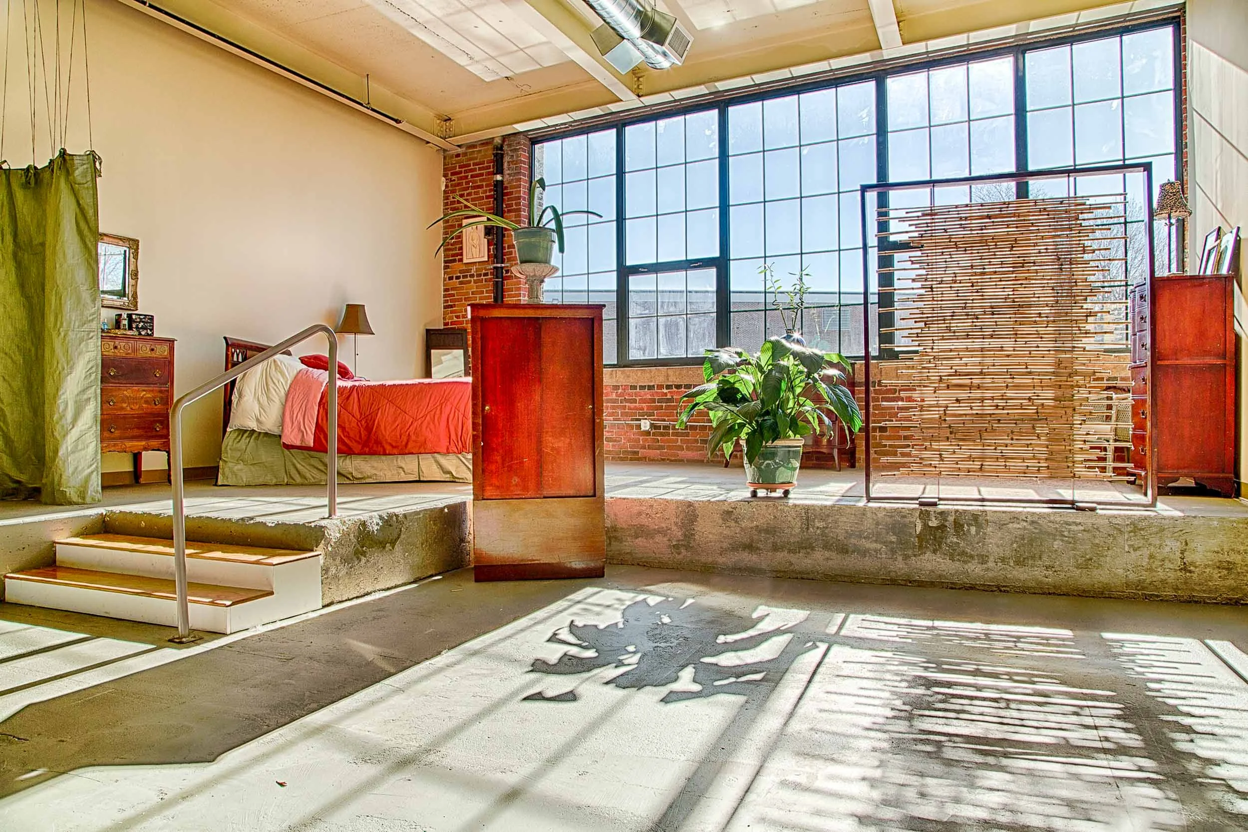 A bright spacious artist's loft interior design. Lowell, MA.