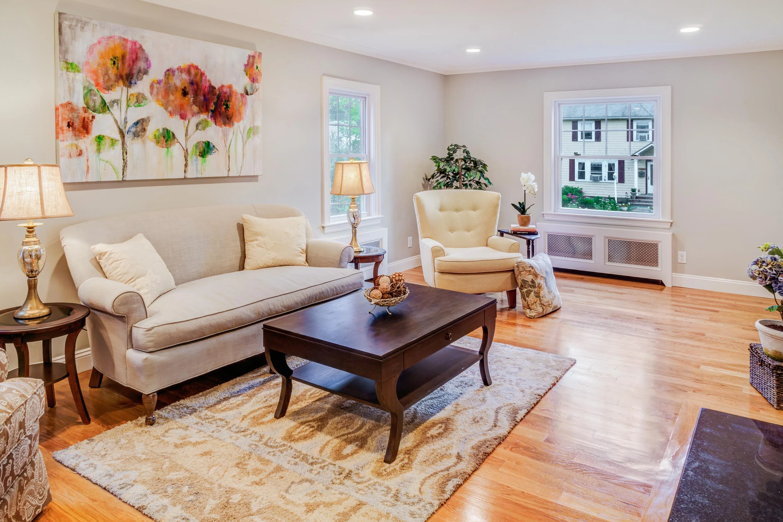 Robin’s egg blue linen living room sofa, lemon zest and taupe paisley fabrics were paired with grays walls.