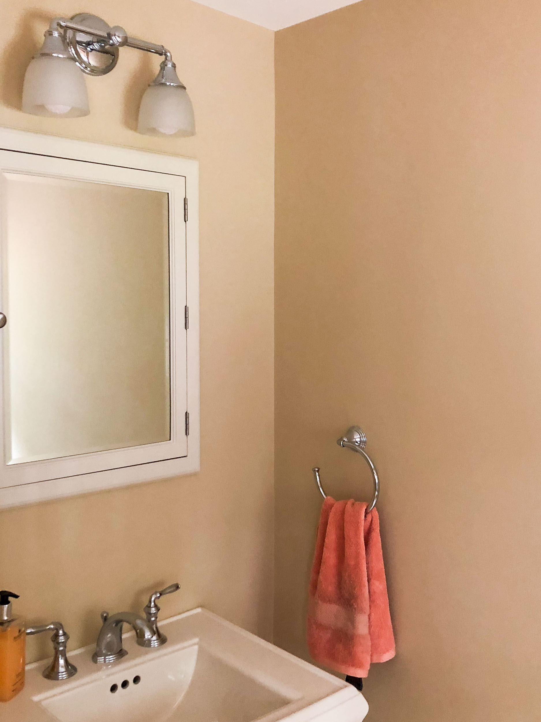 A pedestal sink and vintage style medicine cabinet were included.