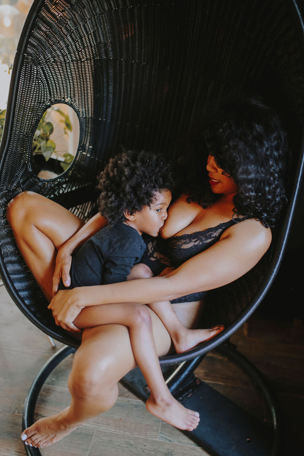 Black woman breastfeeding her child extended breastfeeding.jpg