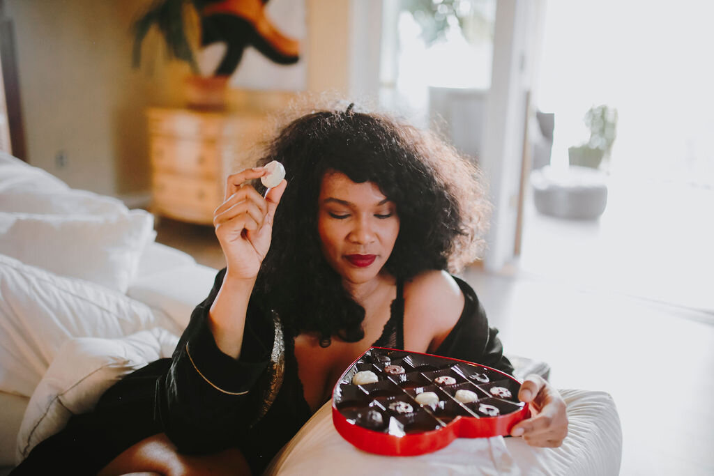 Black woman eating chocolate.jpg