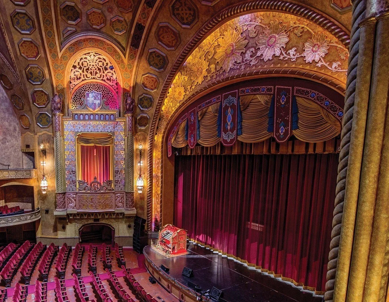 Alabama Theatre Birmingham historic movie palace interior with ornate ceiling, grand stage, and dramatic lighting for events.