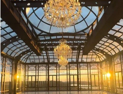European-inspired glass atrium wedding venue overlooking the Tennessee River at Stone Haven in Section Alabama.