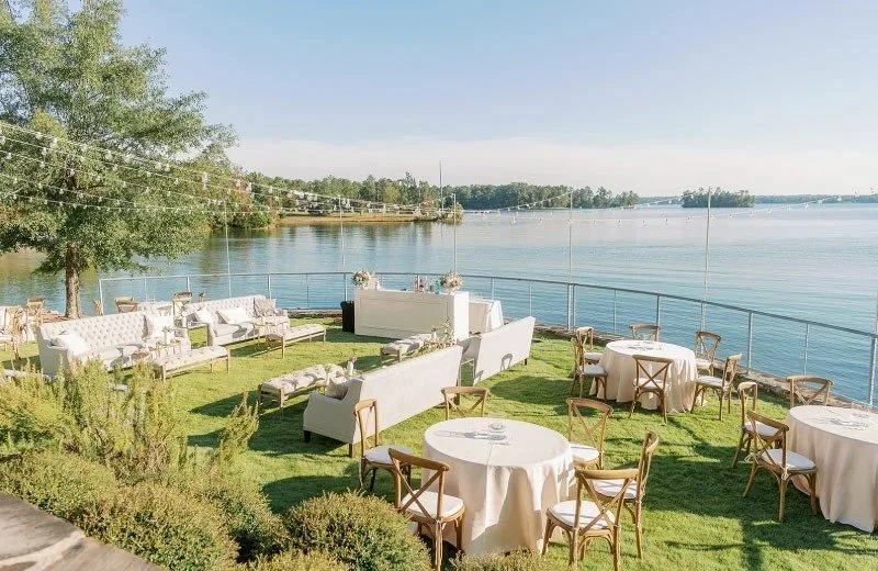 The Lodge at Cocktail Slough on Lake Martin in Alabama featuring upscale lakefront wedding and event spaces surrounded by wooded scenery.