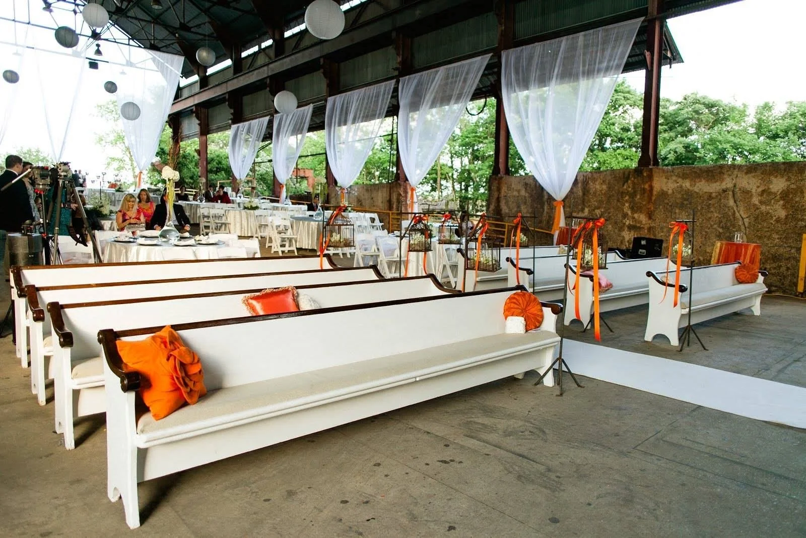 Outdoor event setting surrounded by historic industrial structures at Sloss Furnaces in Birmingham, Alabama