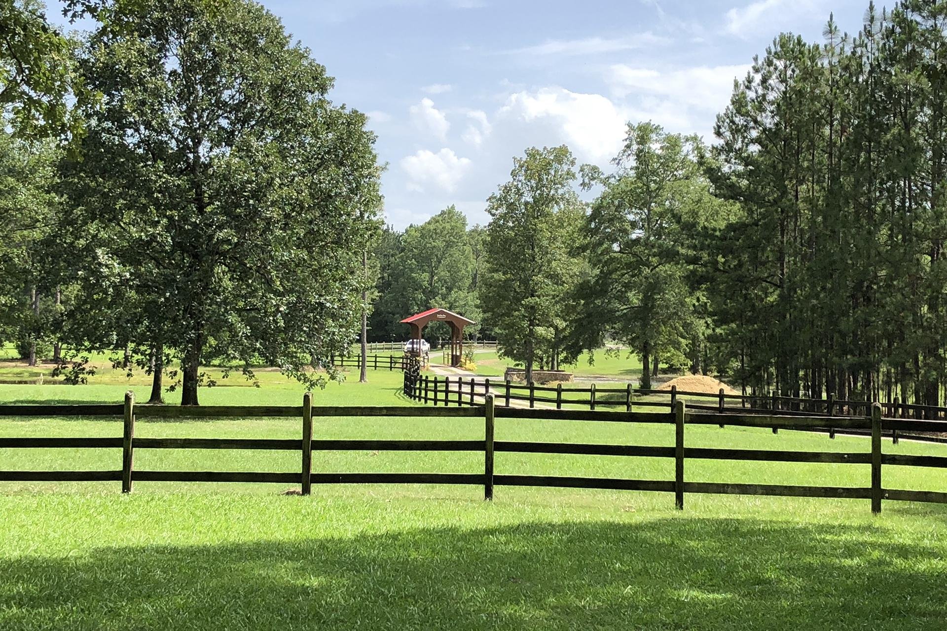 Covered bridge at Shadow Wood Manor wedding venue in Moody, Alabama catered by Tre Luna Catering.