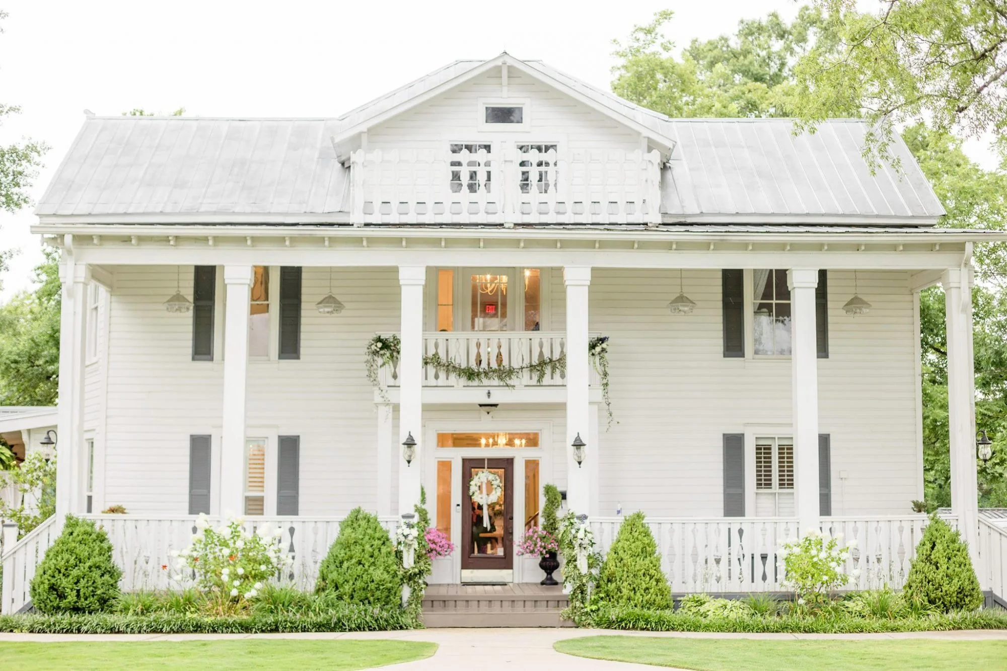 Camelot Manor wedding venue in Westover Alabama with historic home, landscaped grounds, and open-air pavilion for events