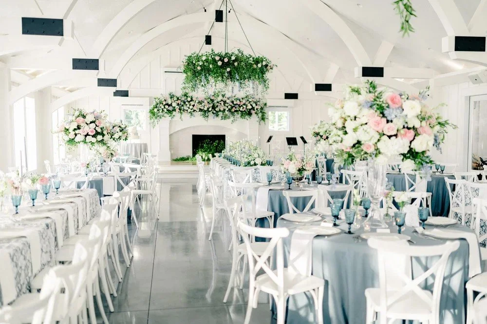 Modern white farmhouse wedding venue at Oak Meadow Event Center in Ohatchee, Alabama.