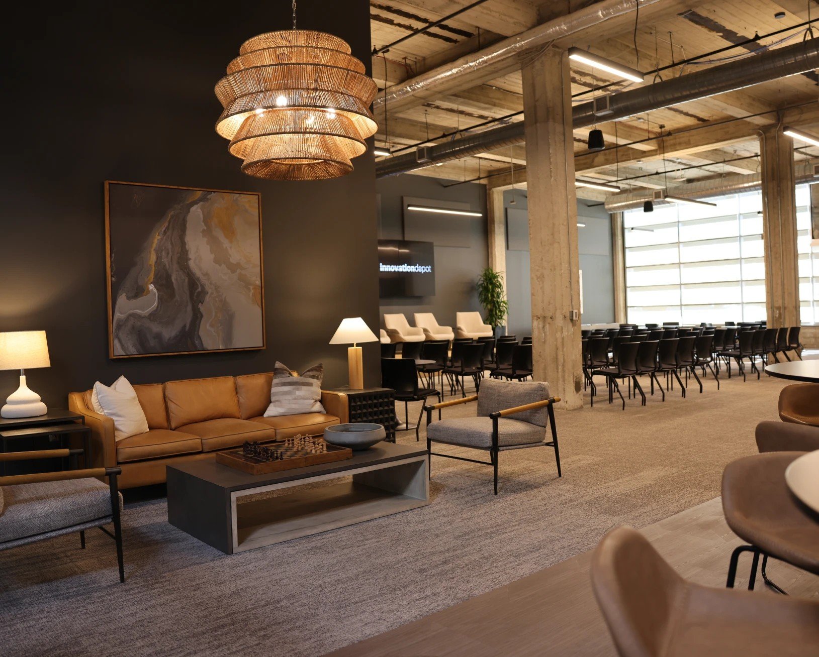 Main event space at Innovation Depot in downtown Birmingham with modern even space featuring exposed brick, high ceilings, and flexible layout for corporate conferences and special events.