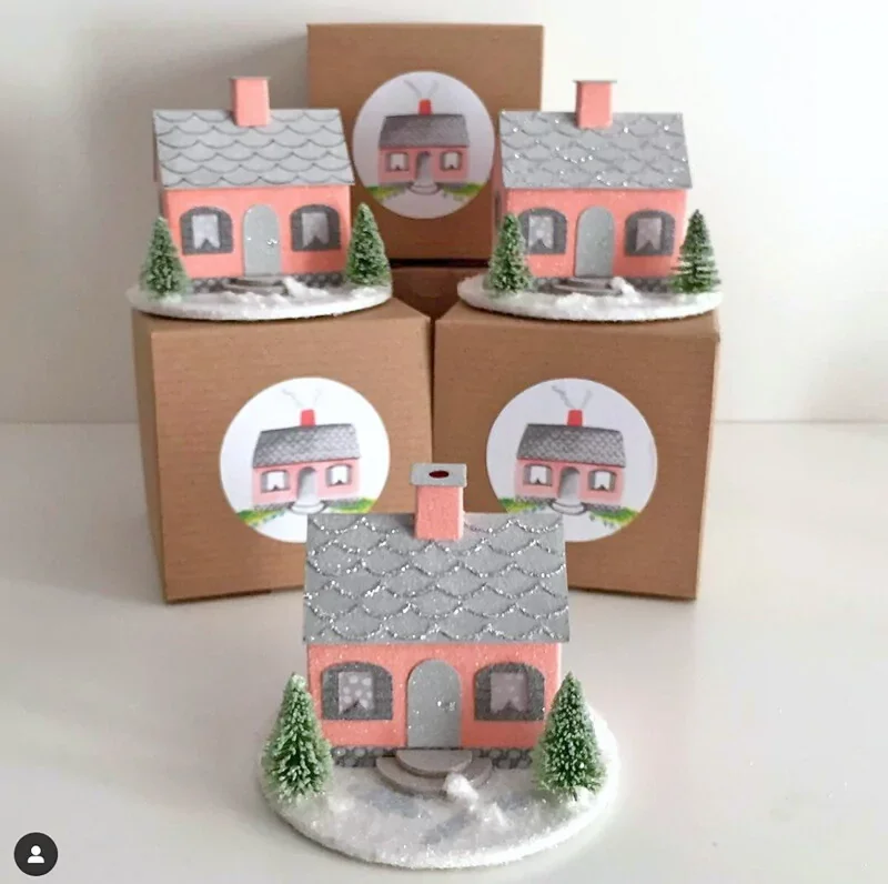 Coral pink putz house ornaments to commemorate the 75th anniversary of Virgina Lee Burton's Little House book.