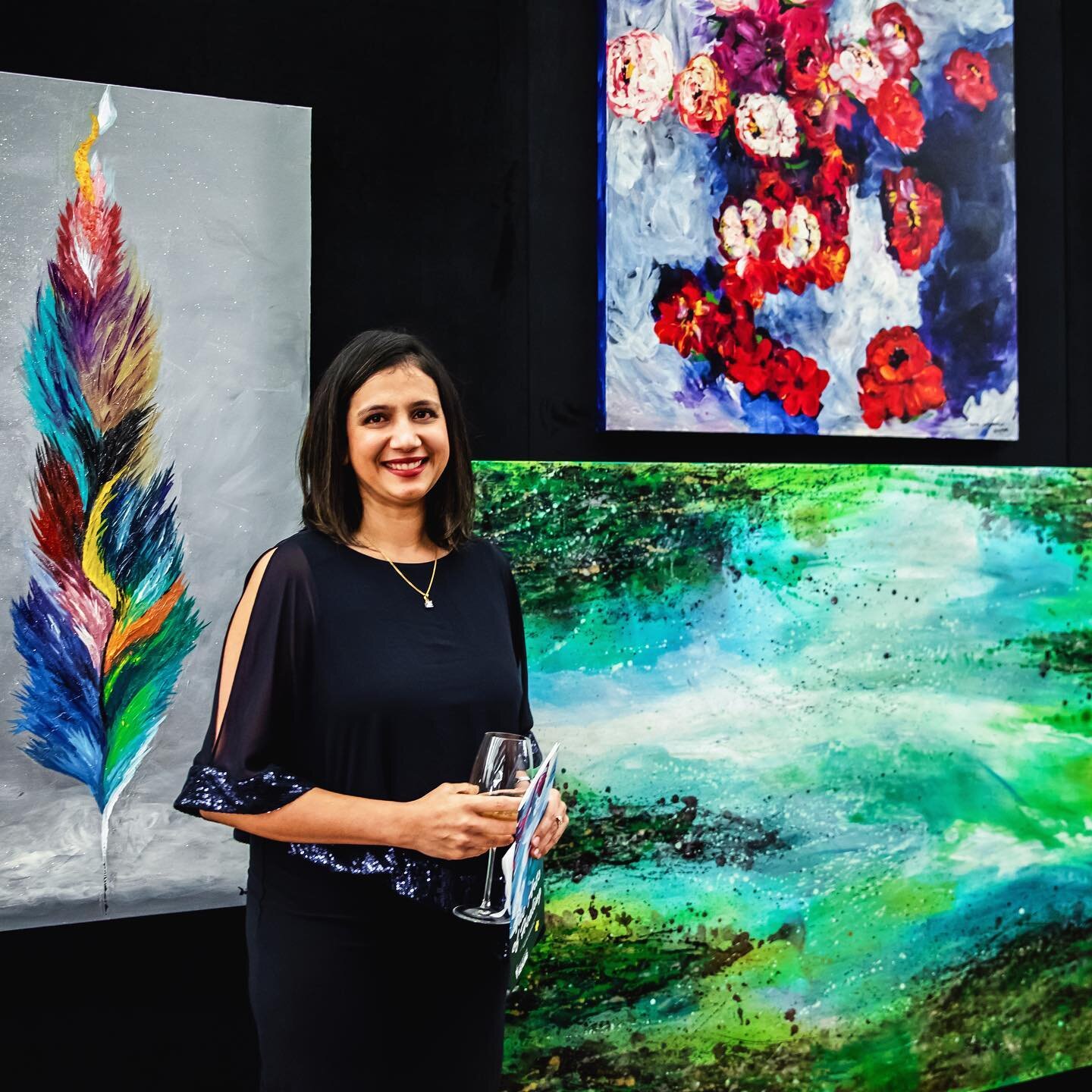 Dr. Divya Chirumamilla, MD
 pictured with her beautiful
artwork at our 2019 gala. ⚡️
The Physicians we work
with have the unique ability
to connect to their patients
through art. 🎨
Through medicine, art,
creativity and community,
we impact physician
