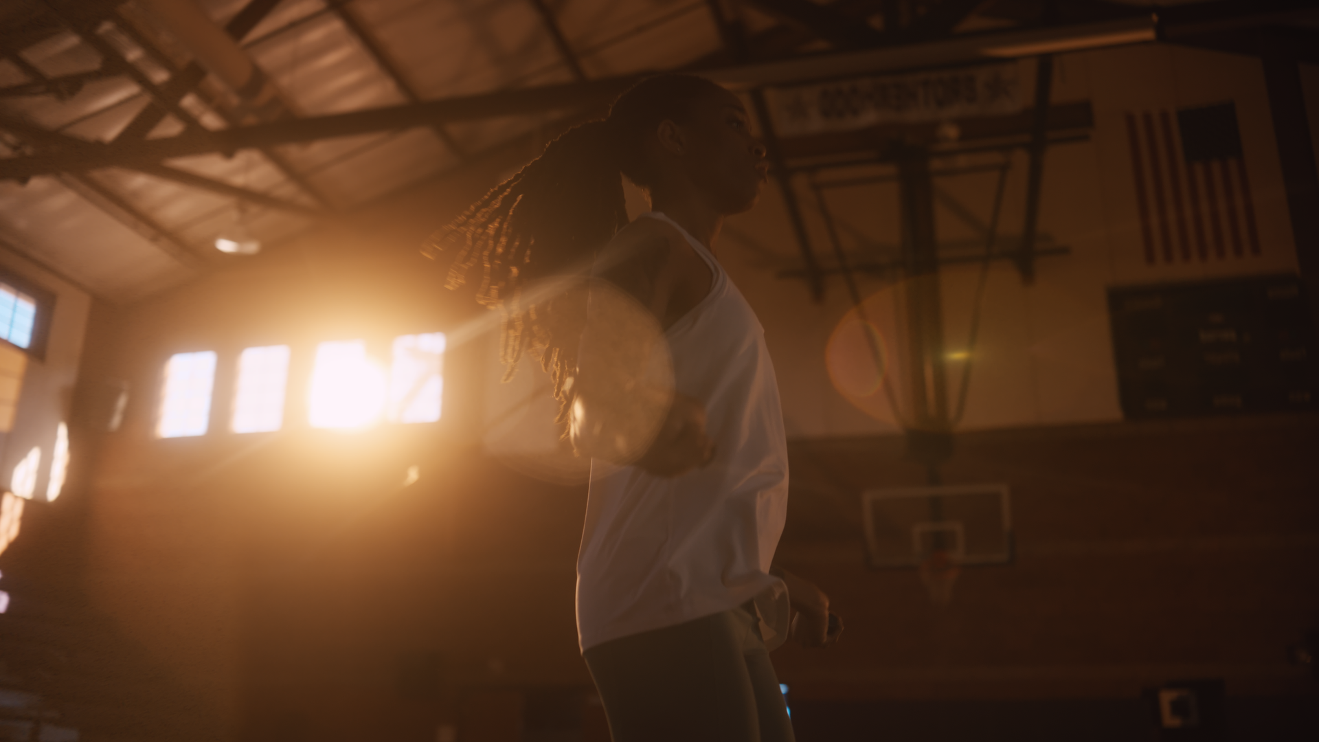 A female basketball player with dreadlocks in a sports gymnasium, backlit by sunlight through windows, wearing a white sports jersey.