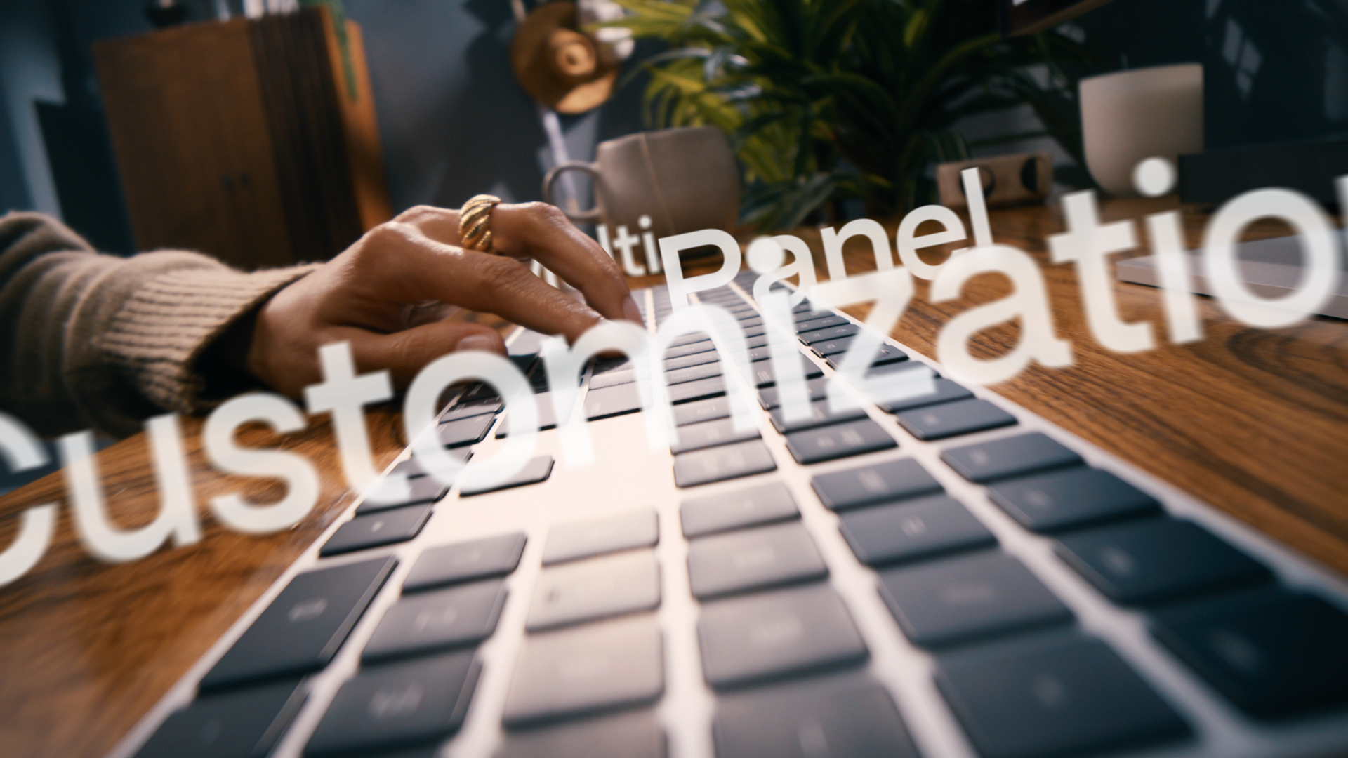 Close-up of a person's hand with a gold ring typing on a computer keyboard, with overlayed text including words like 'Dashboard' and 'statistics' in a modern office setting with plants, mug, and other office items.