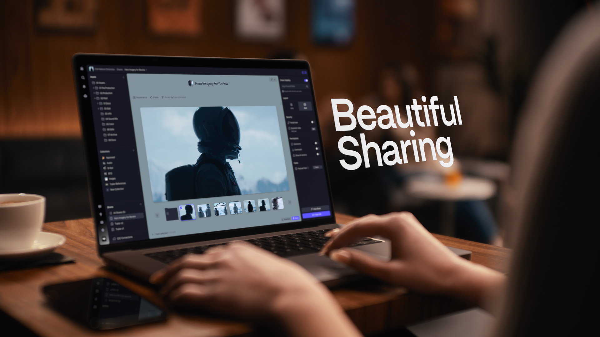 A person using a laptop at a wooden table with a coffee cup nearby, editing a photo of an astronaut in a space suit on a photo editing software. The text 'Beautiful Sharing' is overlaid on the right side of the image.