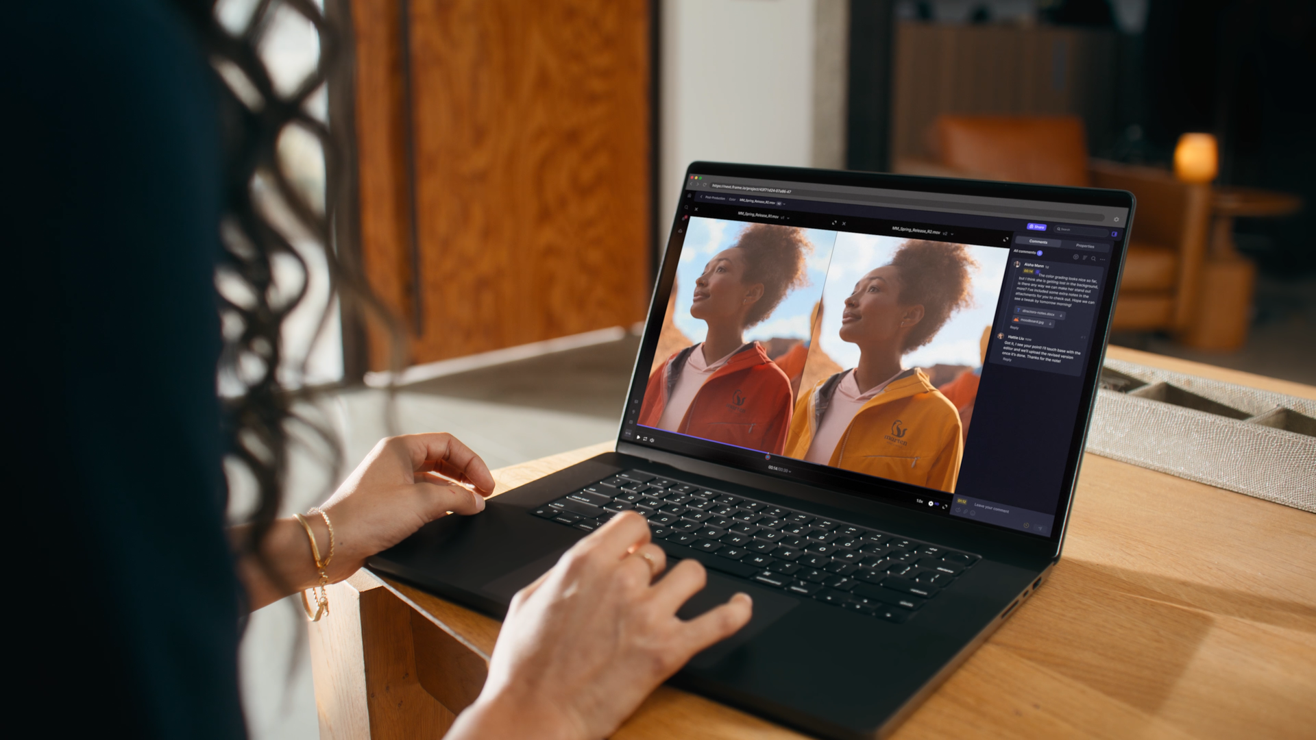 A person using a laptop, viewing a photo editing software showing a side-by-side comparison of a woman in a yellow and a red jacket outdoors.