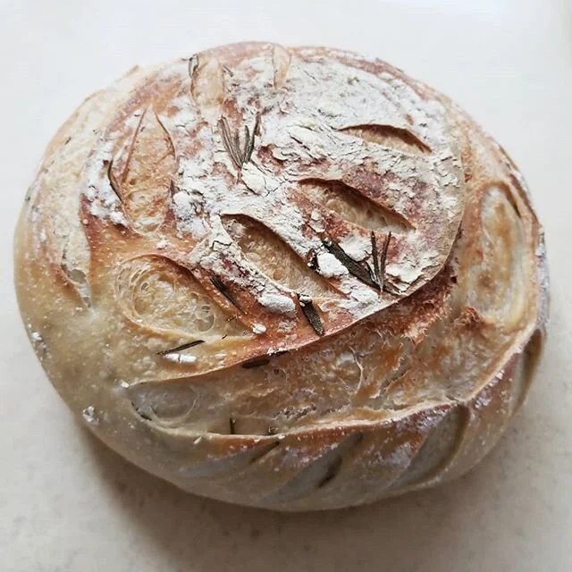 Today's leafy loaf of rosemary sourdough going out the door! Getting outside and meeting new neighbors to share bread has been dreamy. #sourdough #rosemary #breadbaker #boule