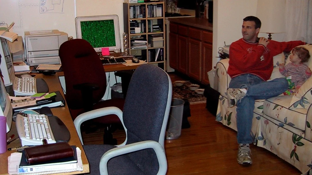 John Pavlick at Sourcefire HQ (aka my living room) in October 2001 with my then 3-month-old daughter, Molly.