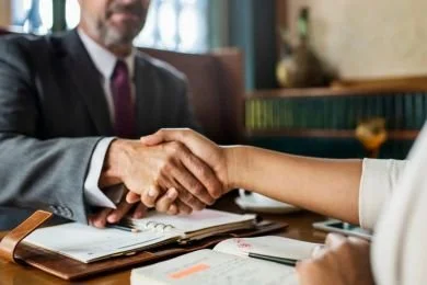 Hands shake for Transparent Flat Fees