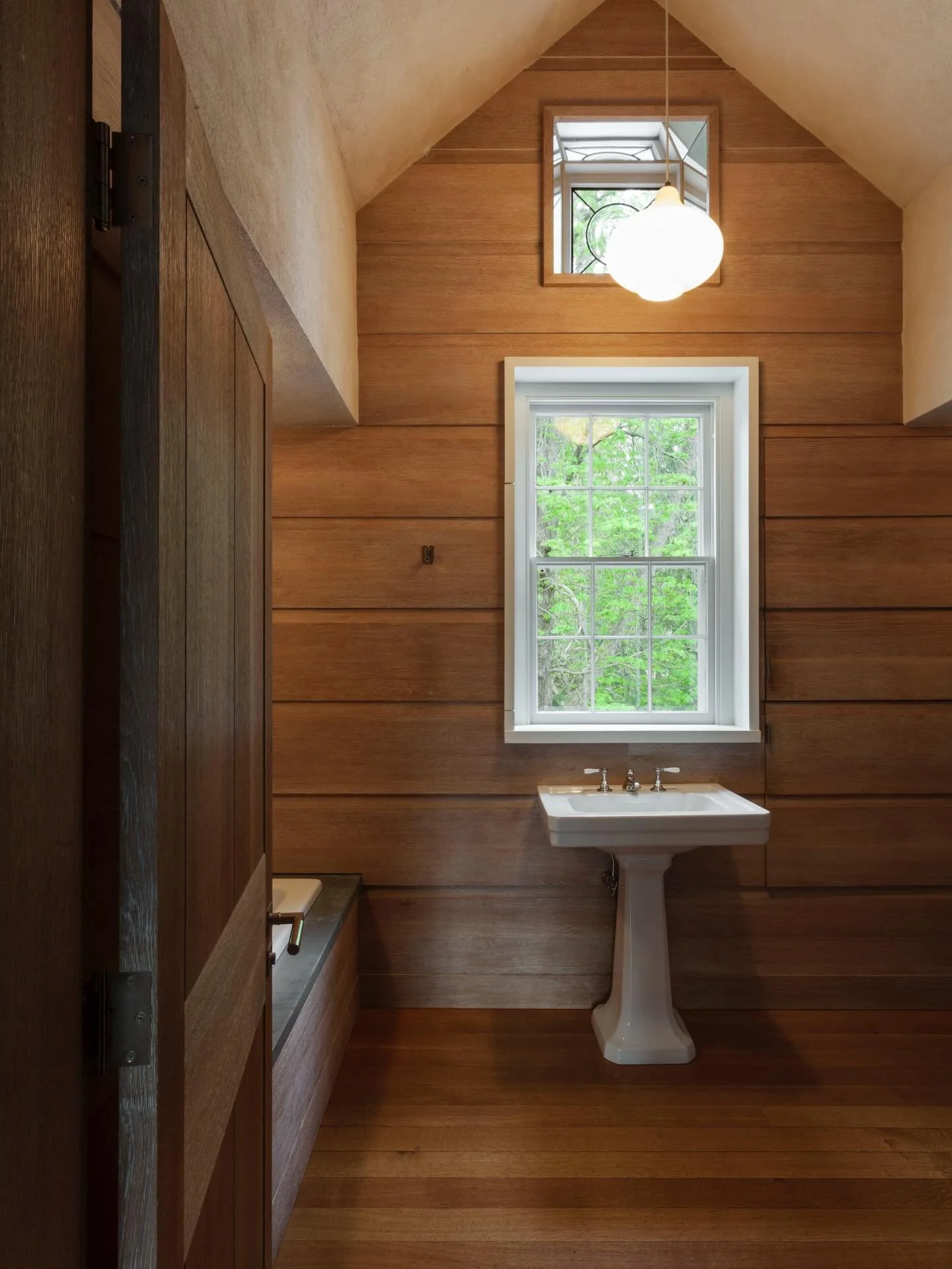 One of my favorite bathrooms&hellip; is the master bath in our CT farmhouse project. Almost spartan in design, it&rsquo;s rich in detail &hellip;like the leaded glass window tucked into the peak of the wall.

#ConnecticutFarmhouse #bathroomdesign #ba
