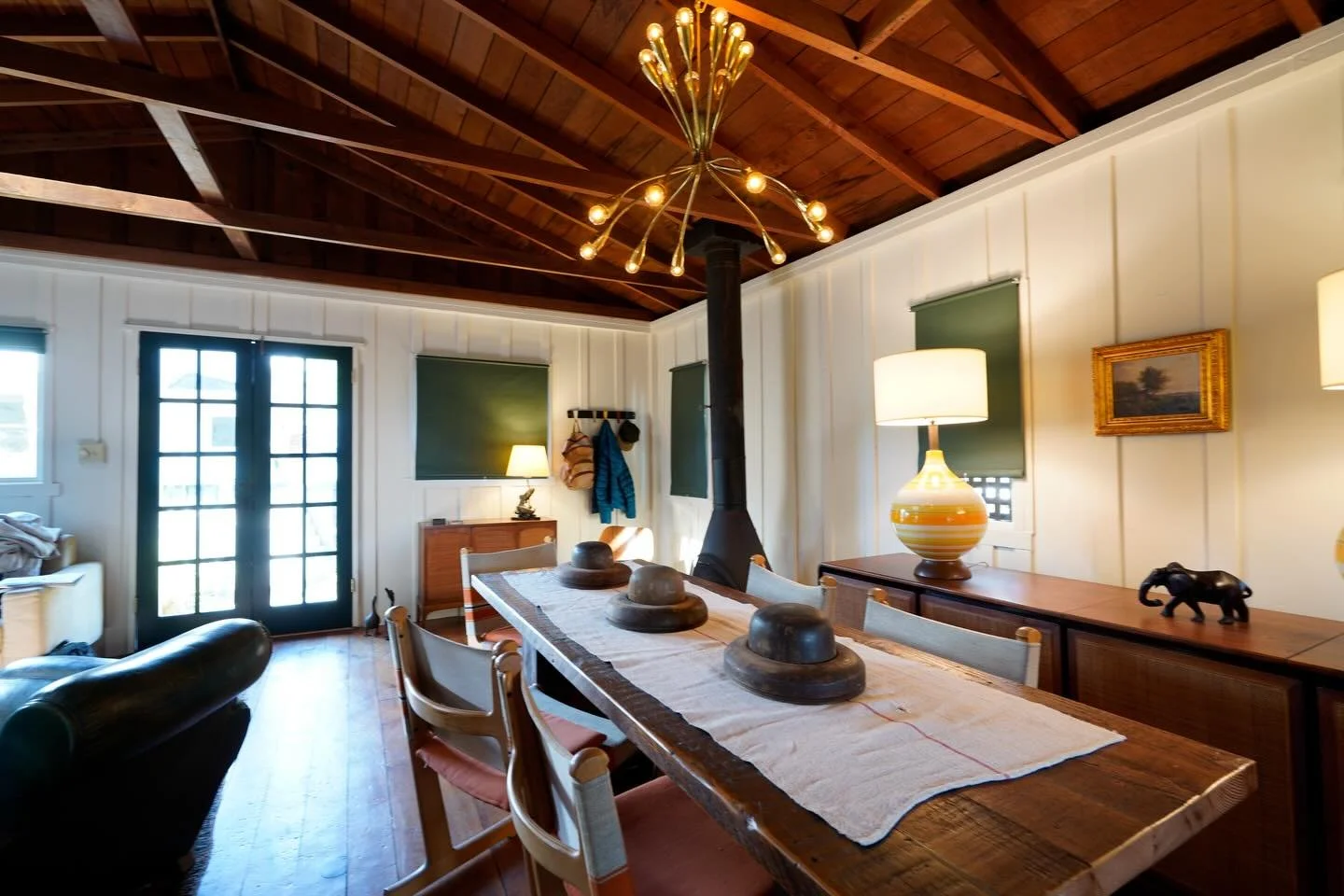 For me, a dining table should be long and skinny. That way you minimize the urge to put lots of stuff in the middle and you encourage lively conversation from all angles. When it&rsquo;s not being used, feel free to display a series of vintage wooden