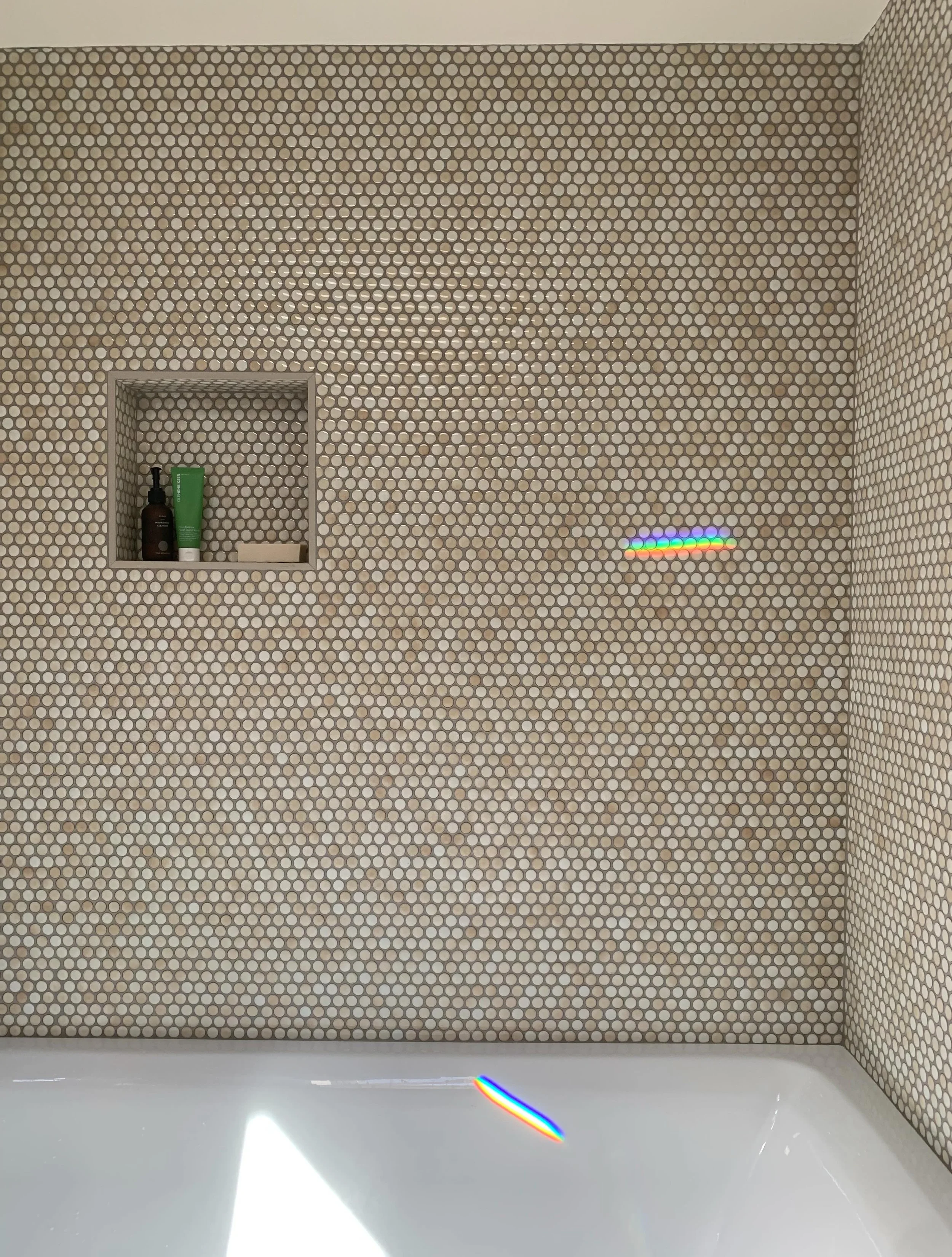 Installing penny tile is a labor of love but my clients are very happy with the look we landed on for their shower and heated floors.&nbsp;

The tile goes from floor to ceiling, which makes the bathroom feel much bigger and brings so much character c