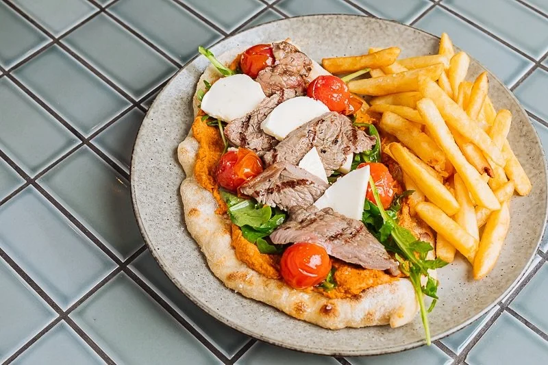 This afternoon, join us for Happy Hour from 3-6pm, then stay on for dinner and try something new like our Open Steak Sanga! 

We cook Southern Ranges SR2+ minute steak until tender and serve it in a sourdough flat bread paired with burst tomatoes, ro