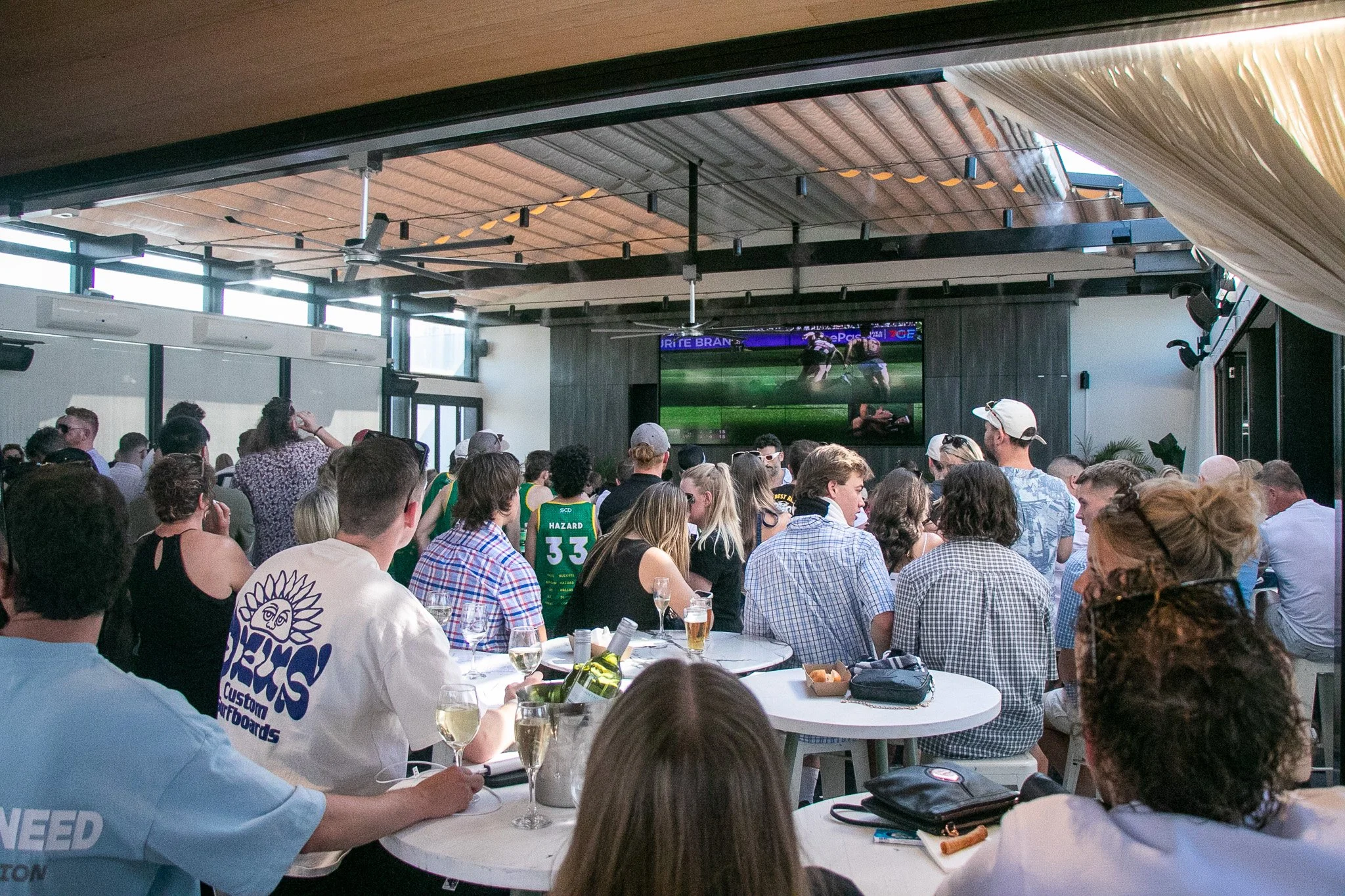 Spend Grand Final Day on our Rooftop.

Whatever Melbourne weather throws at us, our retractable roof has you covered while you catch every minute of the action on our brand new 5 metre mega screen, plus more big screens throughout the venue, giving y