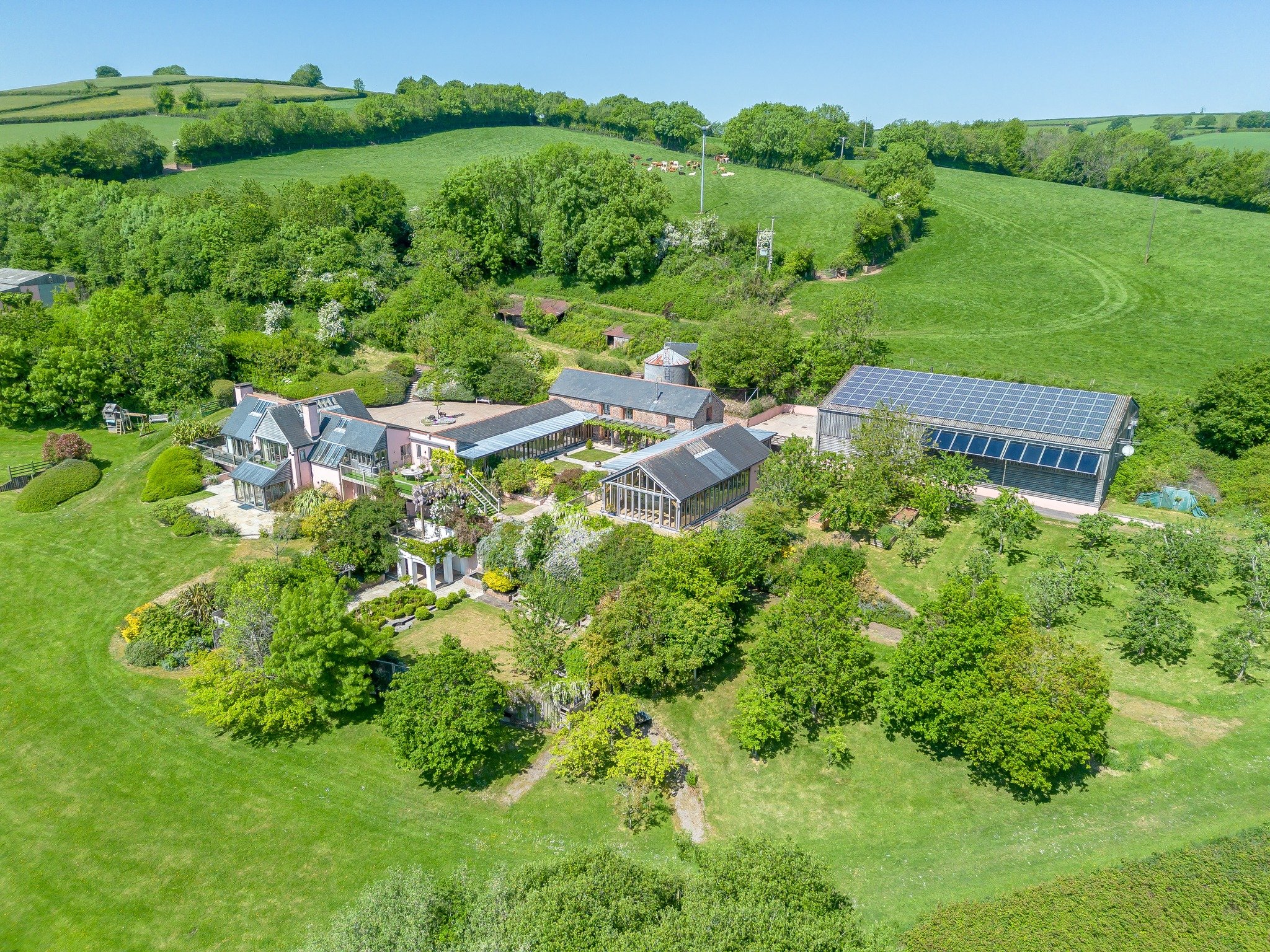 FOR SALE!! Sharps Farm is a magnificent, Roderick James Architect designed detached farmhouse offering more than 6,000 square feet of attractive accommodation configured over three floors. The home was built in 2008 and features characterful detailin