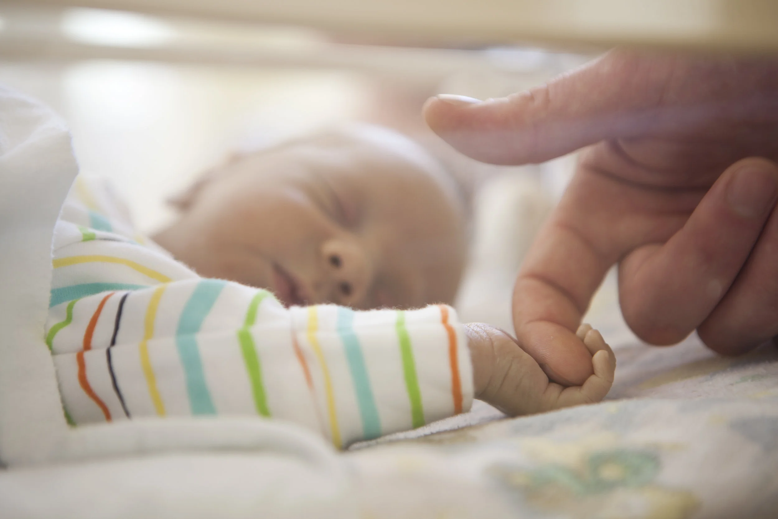 9390-BabyPoverHoldingHand3.jpg