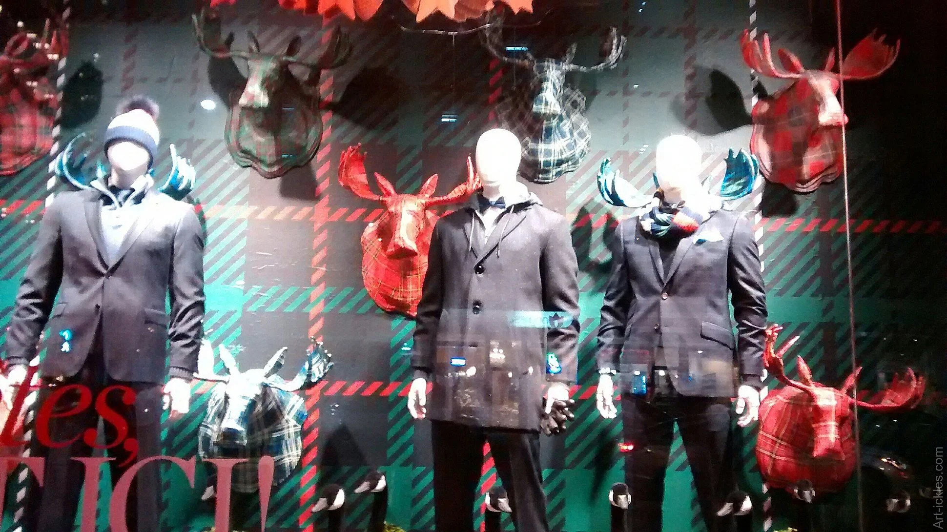 The Hudson Bay window on Christmas with custom handmade paper mache moose head trophies
