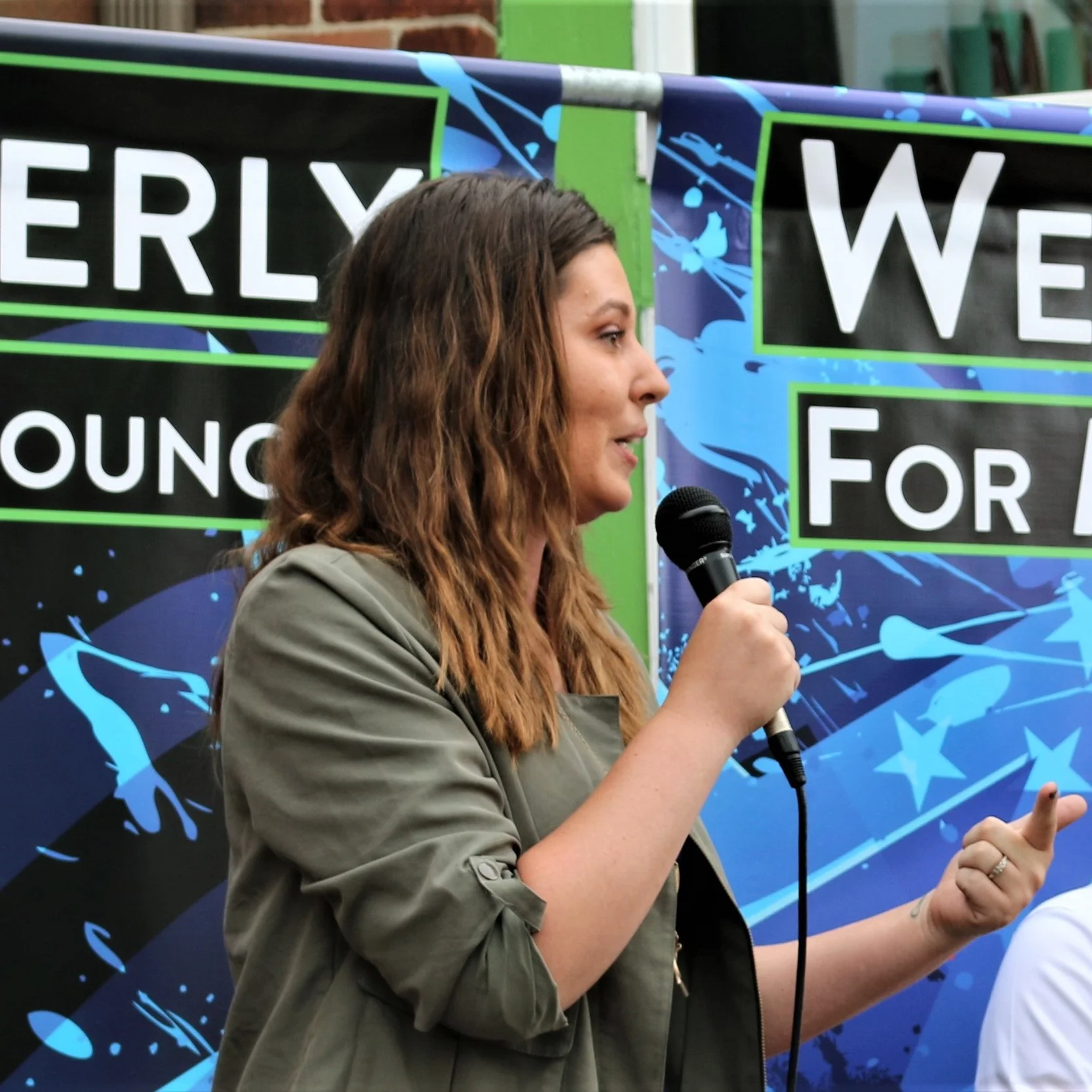 Teresa+speaking+from+stage+to+crowd+-+cropped.jpg