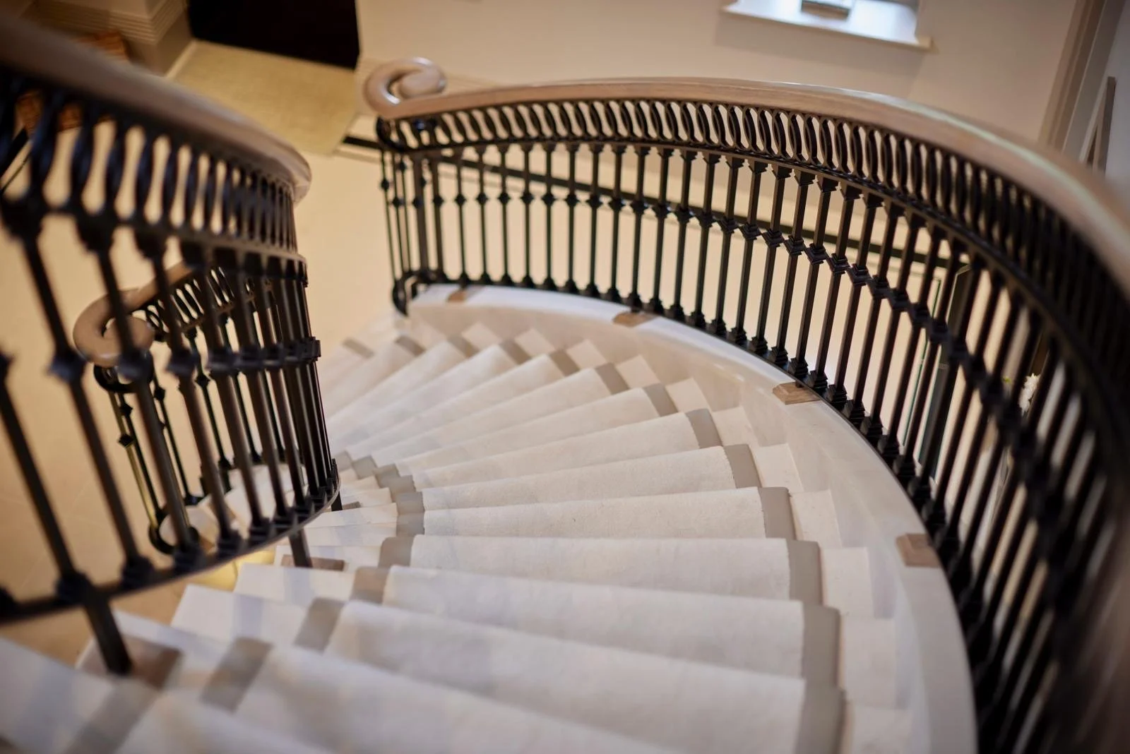 Faux silk carpet stair runner fitted to curved staircase
