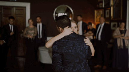 Newlywed couple embracing during their wedding reception in Ireland