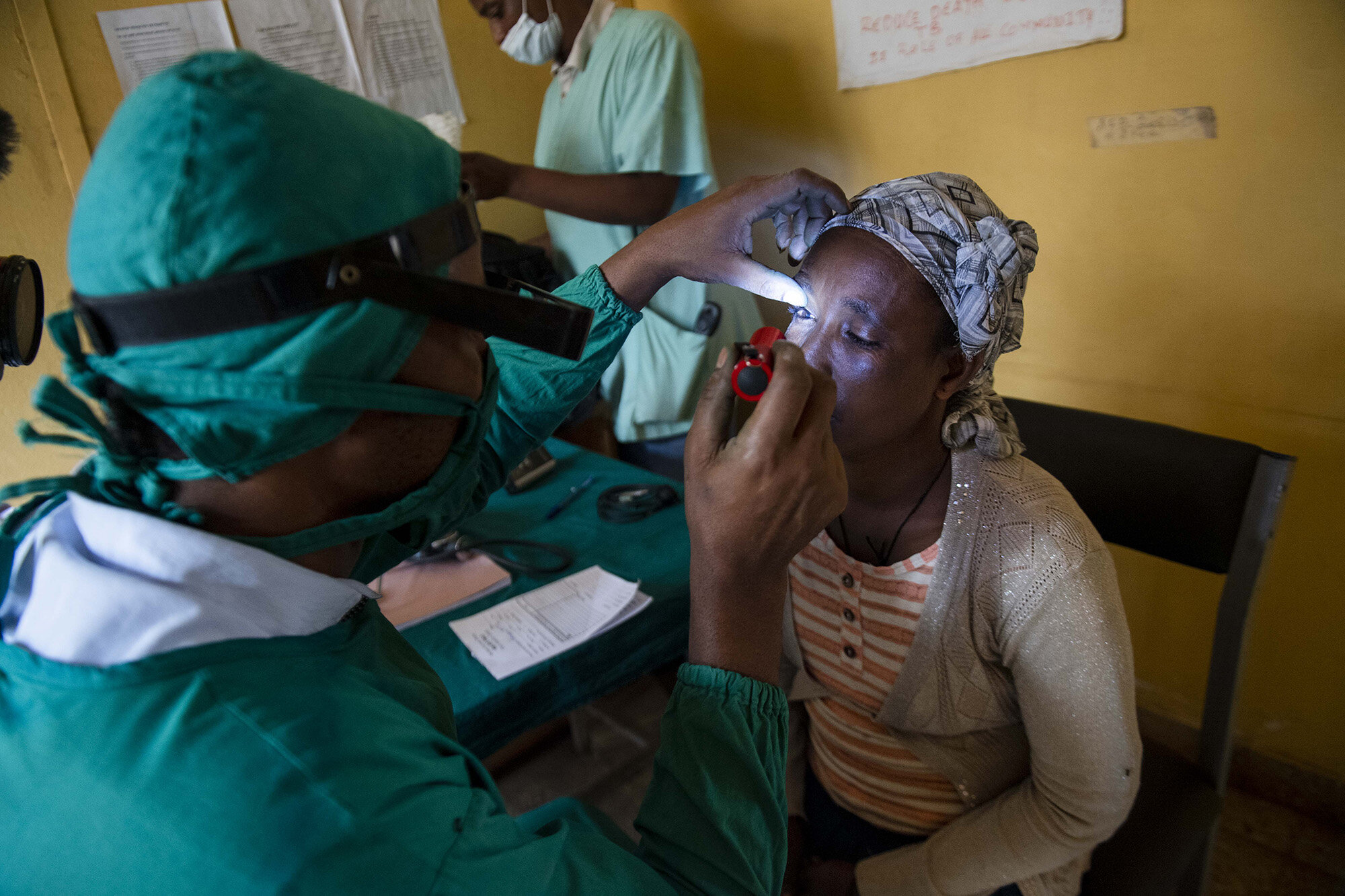  A doctor checks Asnaku Tufa’s eyes for Trachomatous Trichiasis (TT) during a free screening at the Dire Primary Health Care Unit. She tested positive for the disease. 