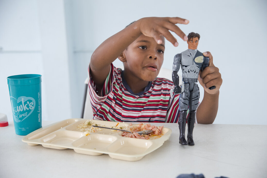 Edison, 7, eats lunch at the Senda De Vida Casa Del Emigrante, a center that houses immigrant families seeking shelter before crossing the border, on Wednesday, June 20, 2018, in the border town of Reynosa, Mexico. Edison's family has been staying a