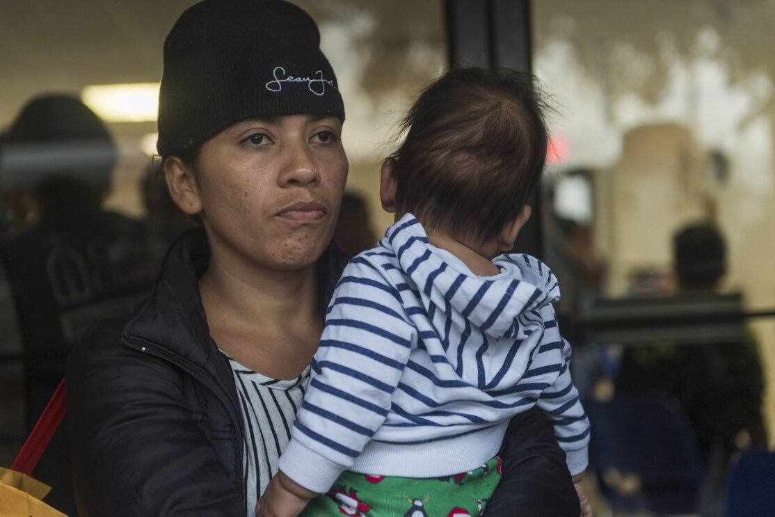  Central American migrant families wait to be taken to the McAllen bus station from the Catholic Charities Humanitarian Respite Center on Tuesday, June 19, 2018, in McAllen, TX. The families were processed and released by U.S. Customs and Border Prot