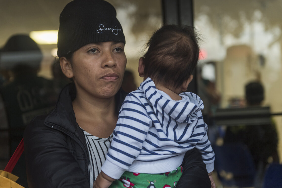 Central American migrant families wait to be taken to the McAllen bus station from the Catholic Charities Humanitarian Respite Center on Tuesday, June 19, 2018, in McAllen, TX. The families were processed and released by U.S. Customs and Border Prot