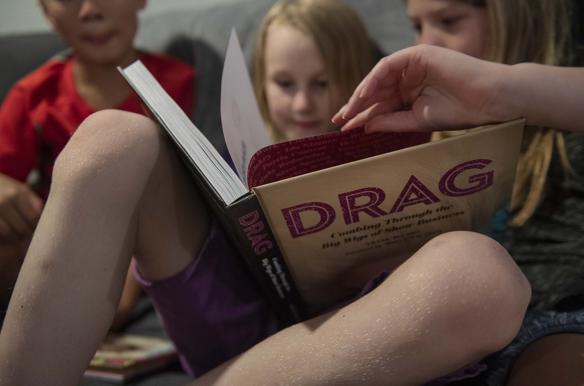  Keegan shows off his Drag book to slumber party guests at his 9th birthday party. "That's a boy and That's a boy, and that's a boy," he announced while explaining the book to friends. Picture taken in 2019. 