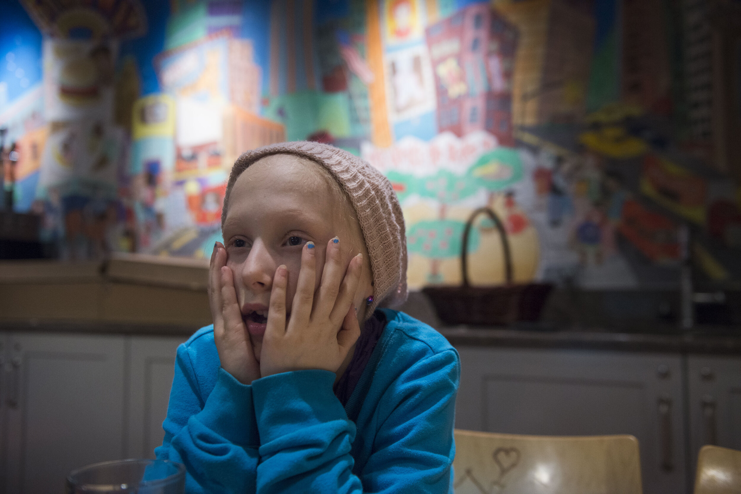 Peyton waits for dinner in the kitchen and dining area of the Ronald McDonald House.