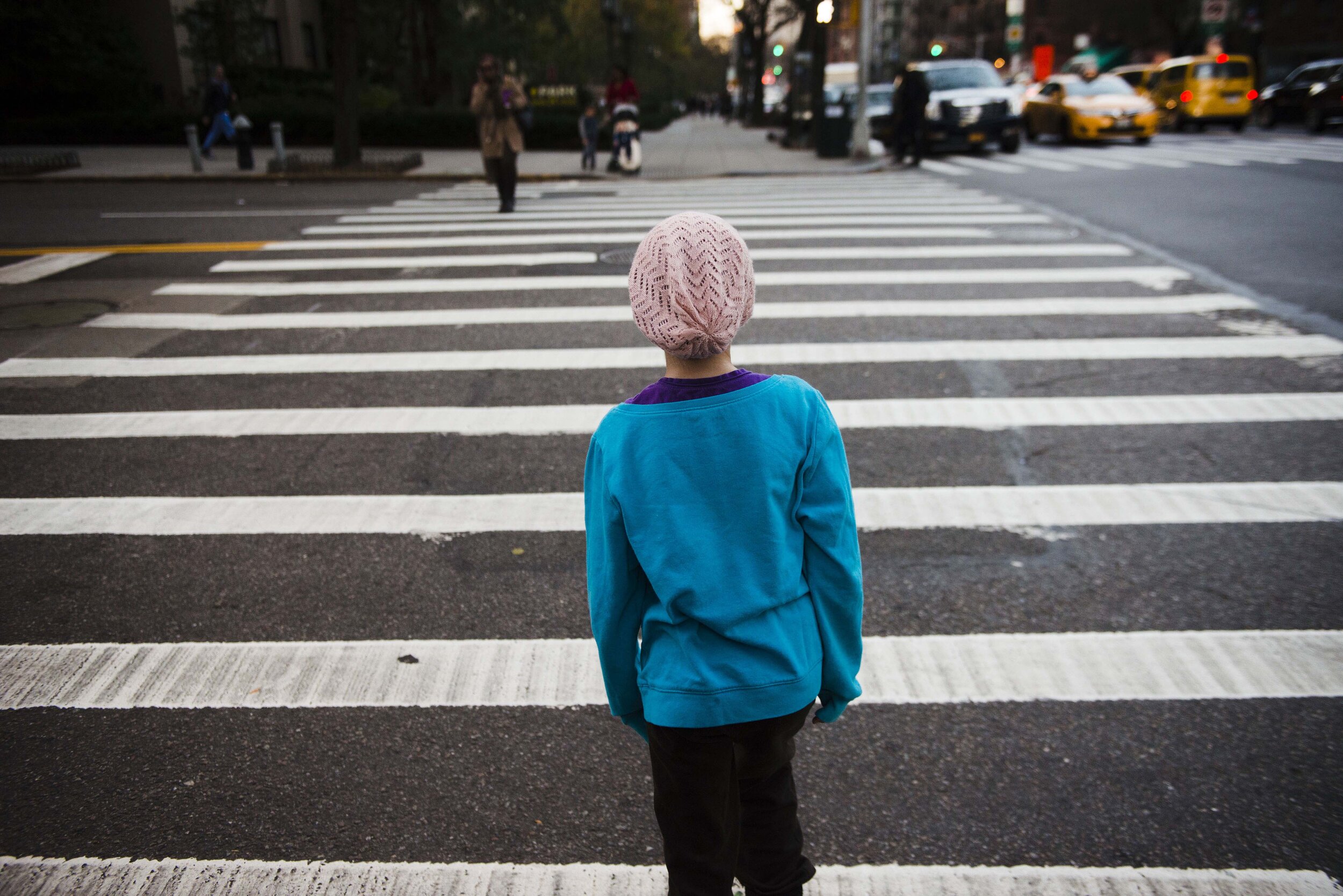 Peyton Walton, 10, pauses at a cross walk in between running down the street following her radiation treatment at the Memorial Sloan Kettering Cancer Center on Monday, November 16, 2015 in New York City, NY. Peyton's mother Lynn Schaeber said Peyton
