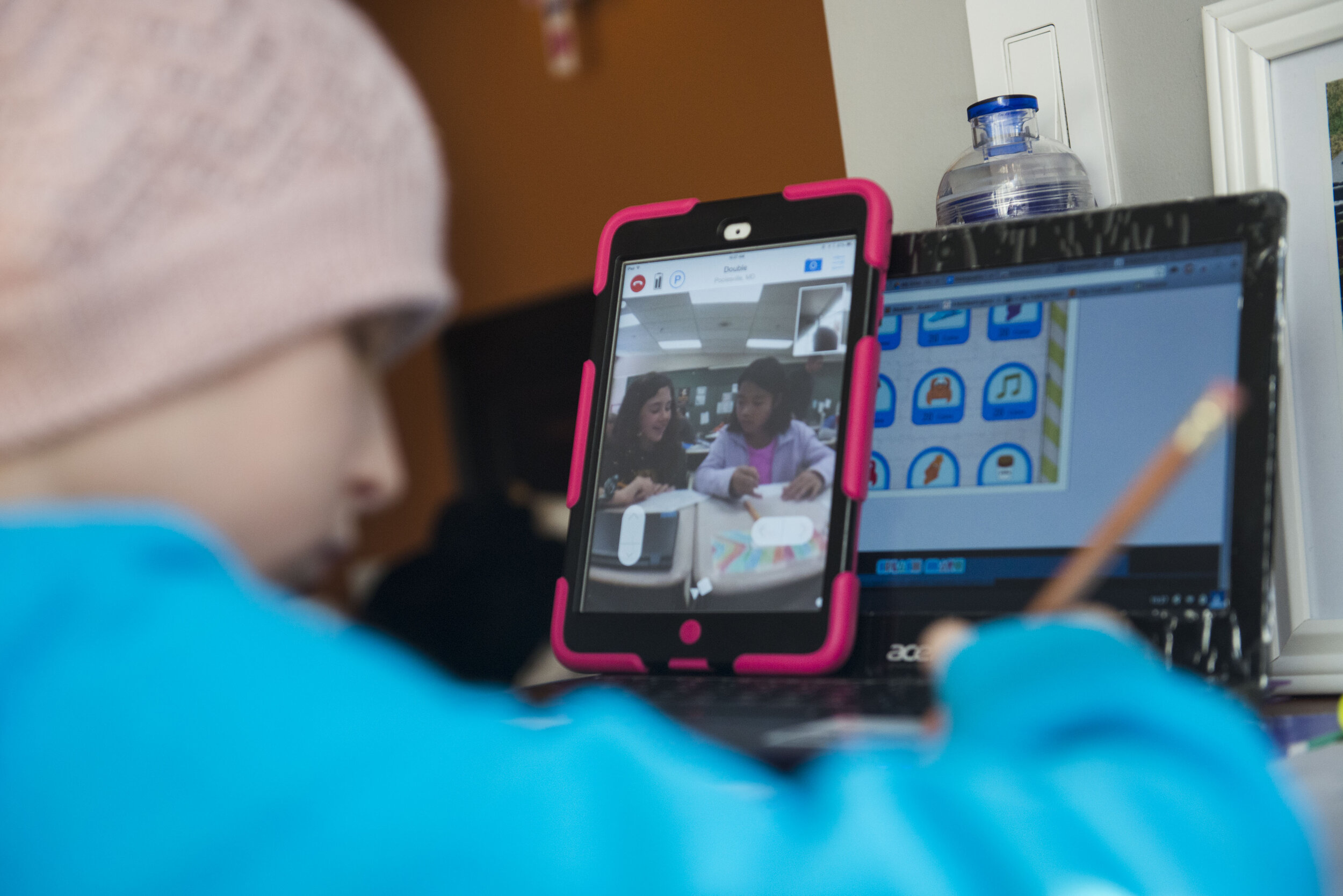  Peyton Walton, 10, and her classmates work on their studies.  