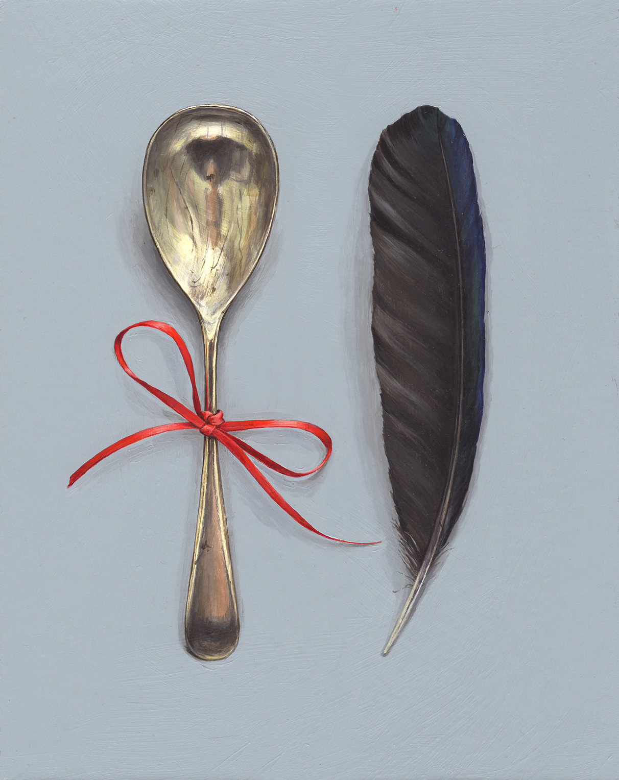 feather with spoon and red ribbon