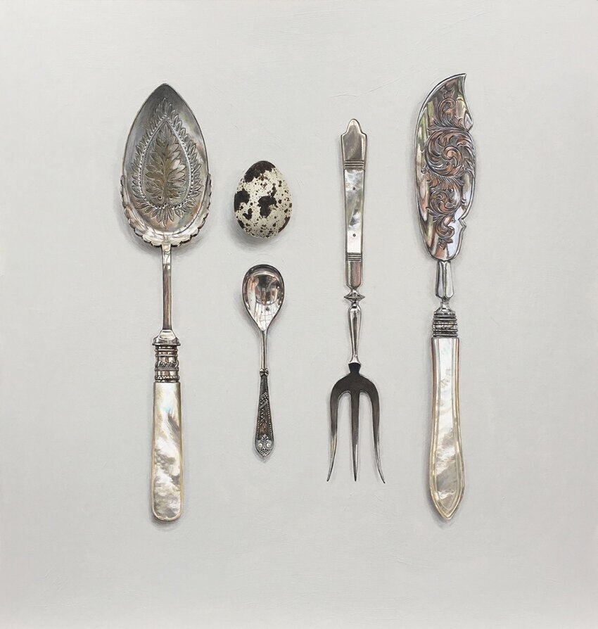 mother of pearl silverware with quail's egg